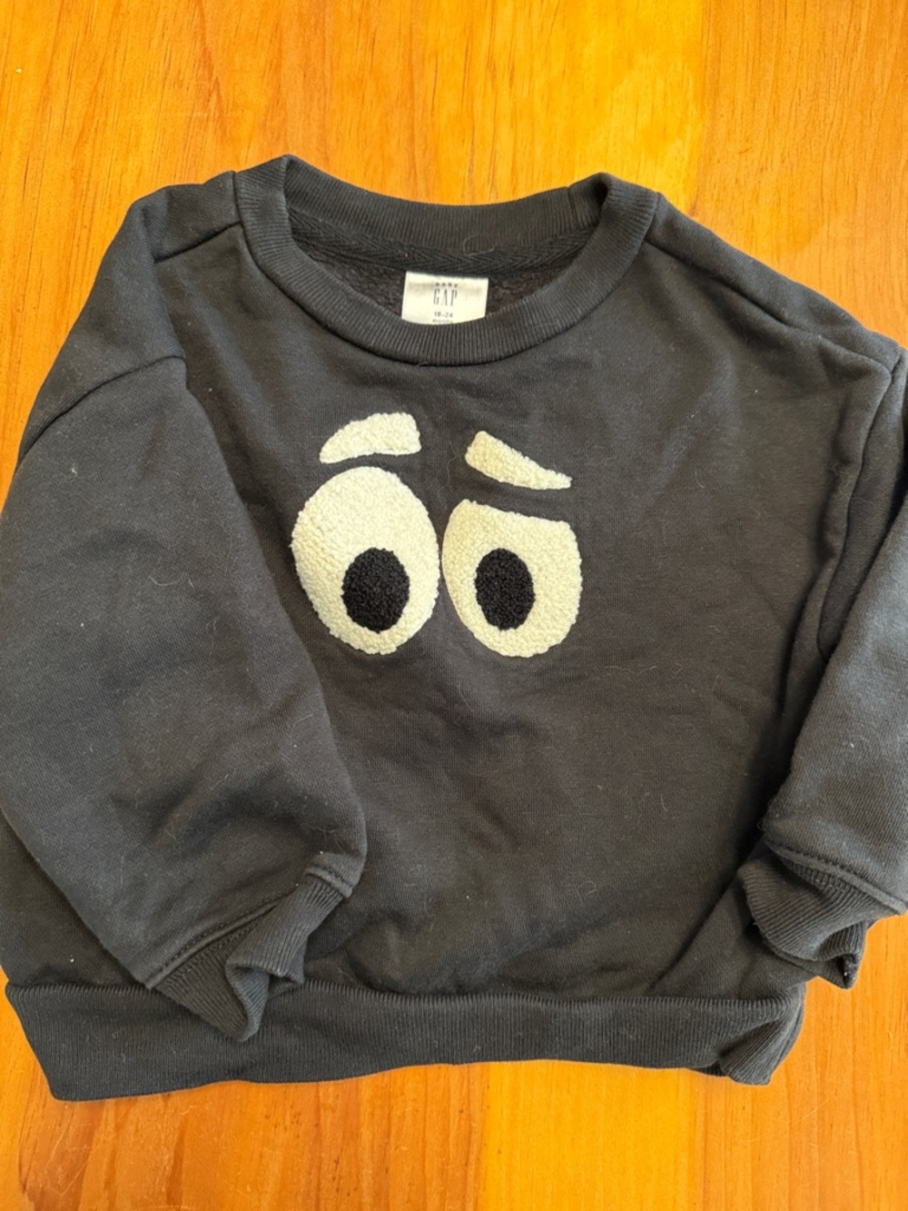 GAP Black Sweatshirt with Cream Eyes Graphic